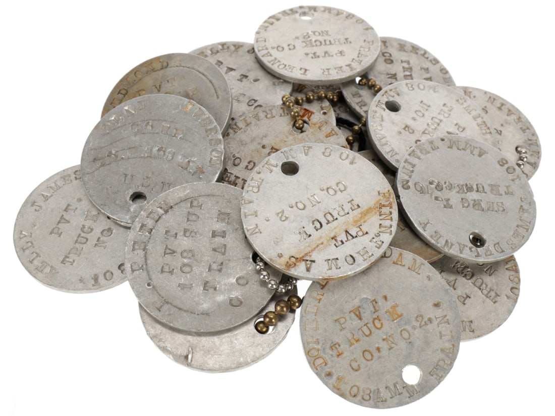 Lot of 19 WWI AEF Soldier ID Tags - All From 108th Ammunition Train, 33rd Division: Lot of 19 WWI AEF Soldier ID Tags - All From 108th Ammunition Train, 33rd Division. Nineteen WWI US Army soldier ID tags including six pairs and seven singles, to soldiers of the 108th Ammunition Trai