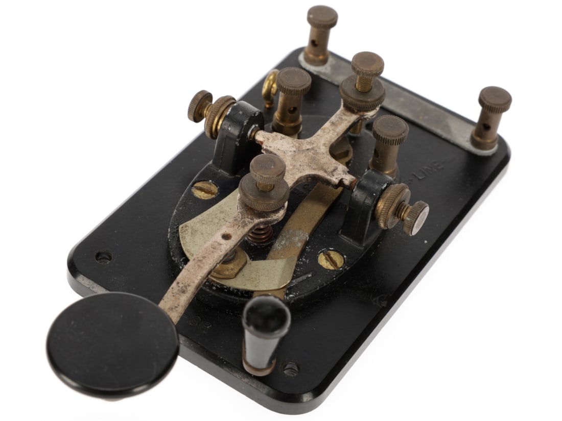 WWII US Army Signal Corps J-38 Telegraph Key: WWII US Army Signal Corps J-38 Telegraph Key Telegraph key for use with a radio / operator training set, manufactured by the Lionel Corporation. Base has rounded corners and a straight sided knob on t