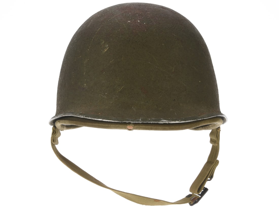 US M1 Helmet with Hawley Liner: US M1 Helmet with Hawley Liner US WWII M1 helmet has front weld seam and fixed chinstrap loops with light olive web chinstraps; exterior retains 70% olive textured finish with areas of light corrosion