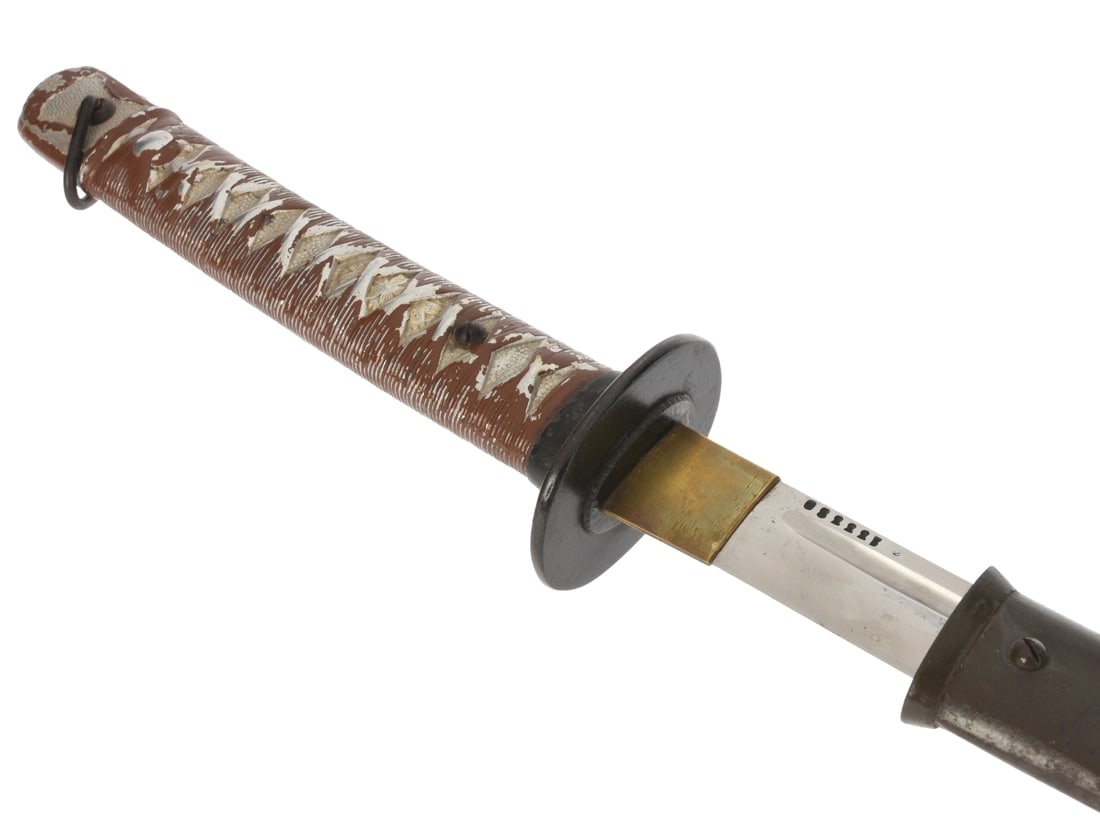 Japanese WWII Type 95 NCO Sword: Matching Numbers: Japanese Type 95 Military Sword. Third variant of this type distinguished by the locking bar on the side of the guard rather than the top. Very nice example; 92.5cm (36-1/2") overall, with serial numb