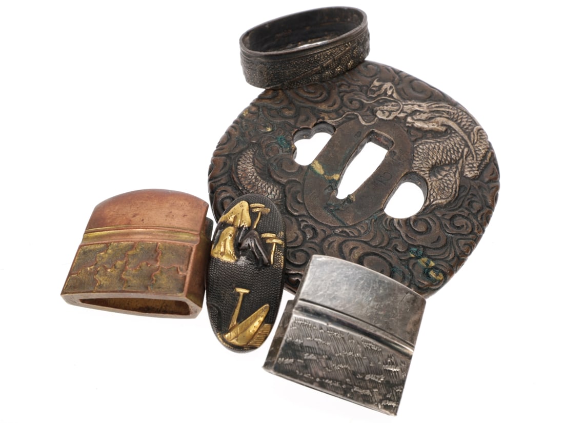 Japanese Tsuba & Fittings Mixed Lot for Civilian Swords: Japanese Tsuba & Fittings Mixed Lot for Civilian Swords Three unrelated fittings, features an iron tsuba with silver inlay dragon, 72.59mm x 75.36mm with tang opening that is 6.79mm at the widest 