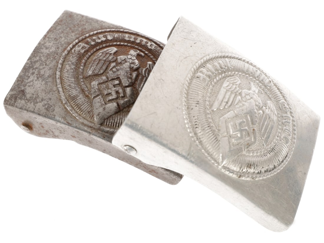 Lot of Two Hitler Youth Buckles: Lot of Two Hitler Youth Buckles. First HJ example is of stamped steel, with RZM M4/24 marking of Friedrich Linden, L?denscheid. Exterior has dark patina and oxidation. Second buckle is aluminum, with 