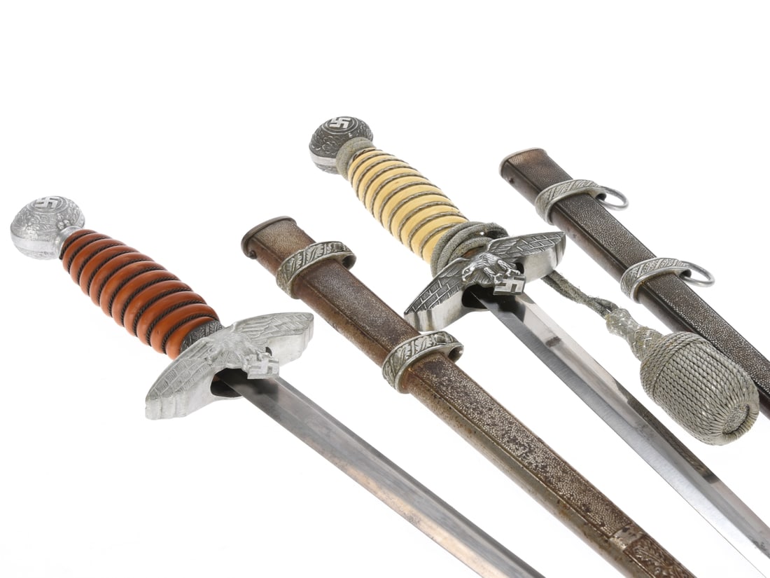 Luftwaffe 2nd Pattern Officer Daggers: Lot of Two: Luftwaffe 2nd Pattern Officer Daggers: Lot of Two. First example is unmarked; has double-edged blade in nice overall condition with several spots of light surface blemishes. Hilt has white