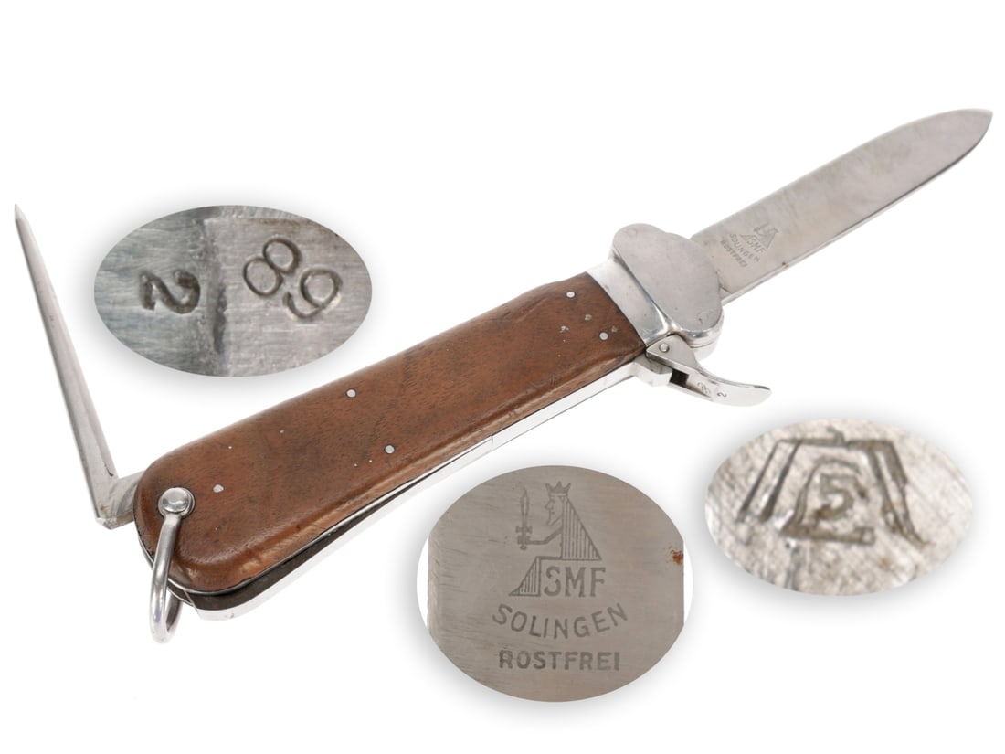 Luftwaffe Fallschirmjager Gravity Knife: SMF: Luftwaffe Fallschirmjager Gravity Knife: SMF Type I knife has stainless steel blade that shows signs of sharpening; etched Solinger Metallwaren-Fabrik Stocker & Co. seated monarch logo over