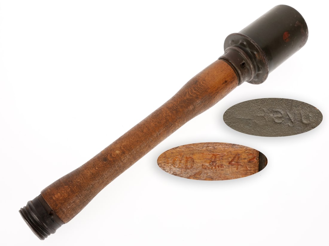 German WWII M24 Stick Grenade (Inert): German WWII M24 Stick Grenade (Inert) INERT 35.5cm (14") long M24 stick grenade has stamped metal warhead with ~65% field gray painted finish blending with dark steel patina where worn. Warning