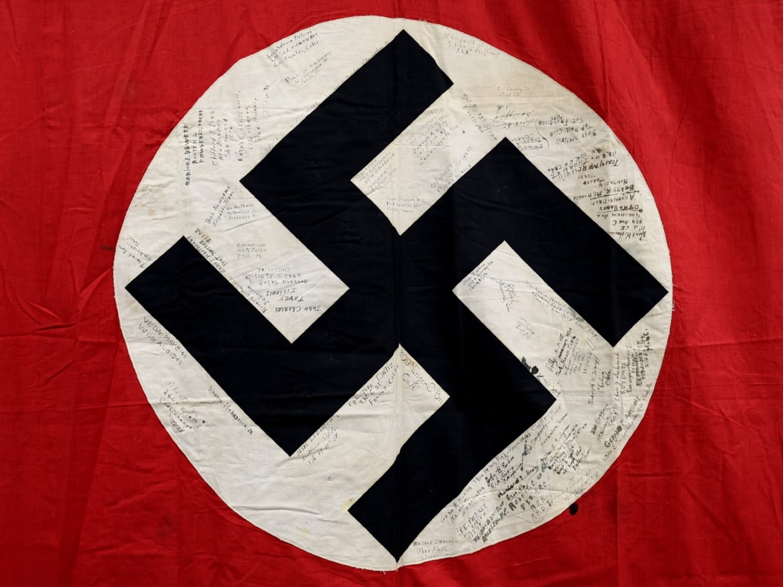 WWII US GI Signed German Banner: WWII US GI Signed German Banner. 127cm x 318cm (4'2" x 10' 5" 125") NSDAP party banner has rope suspension with clip fittings on either end. Pieced construction, double-sided, with 32" diameter center
