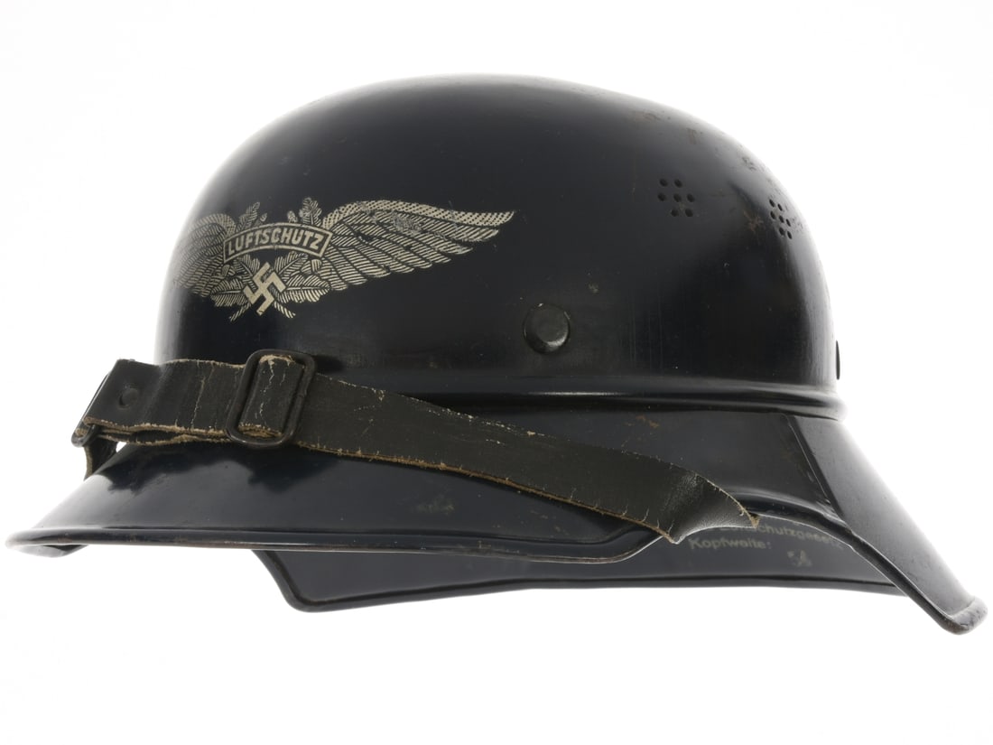 WWII German Three Piece "Gladiator" Style Luftschutz Helmet: WWII German "Gladiator" Style Luftschutz Helmet. Three piece Luftschutz helmet retains 90% smooth blue paint, mostly missing from the top of the crown where there is a silver dollar sized dent. Silver