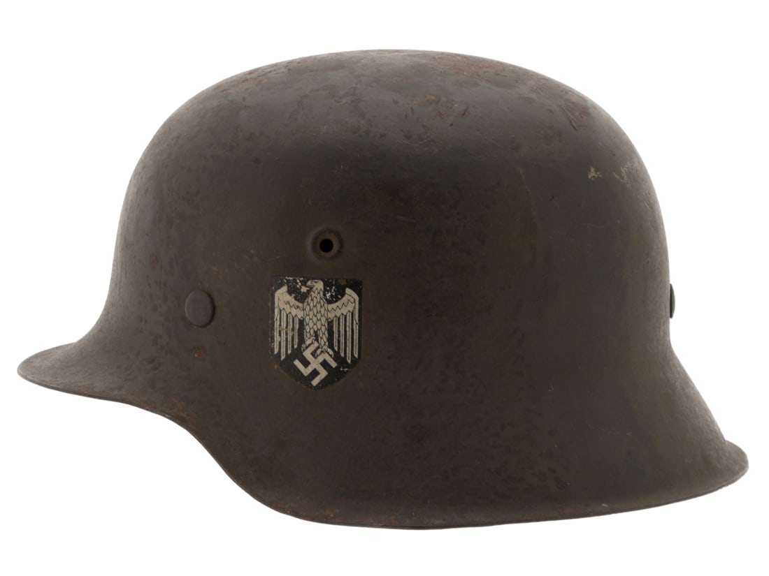 Army Single Decal M42 Helmet: Army Single Decal M42 Helmet. Model 42 stalhelm has ~60% feldgrau finish blending with patina on the worn areas; left side retains 80% of the Army decal. Interior has a good brown leather M31 liner wh