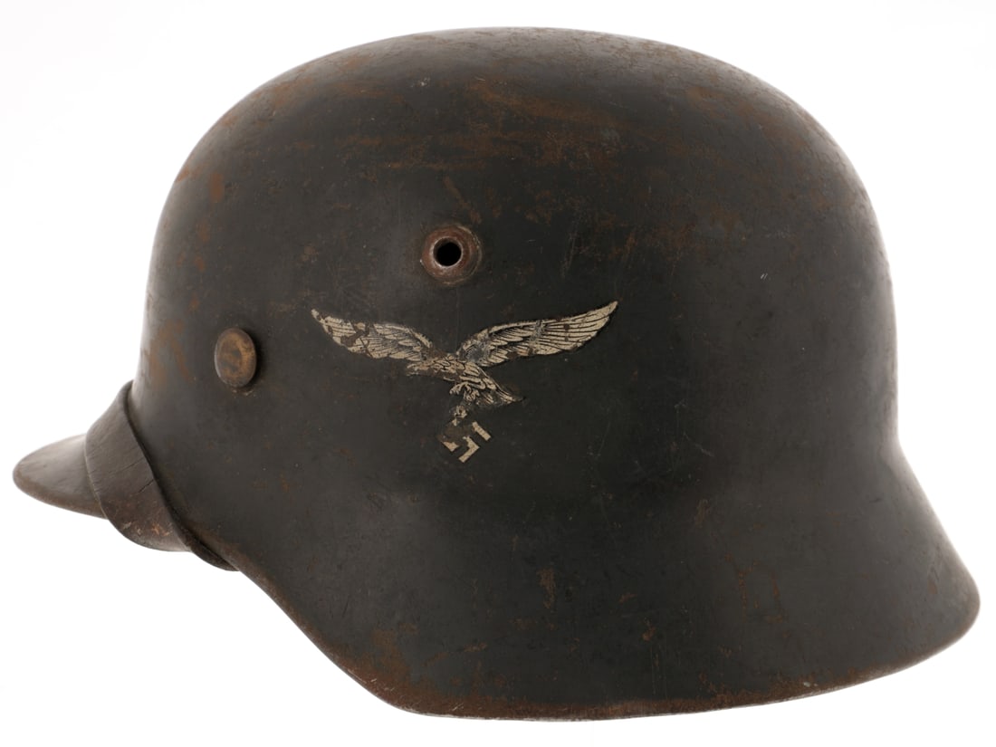 Luftwaffe Double Decal M35 Helmet: Luftwaffe Double Decal M35 Helmet Model 35 helmet retains 70% Luftwaffe dark blue finish with oxidized steel patina in the worn areas; left side has Luftwaffe eagle decal, and the right has the nation