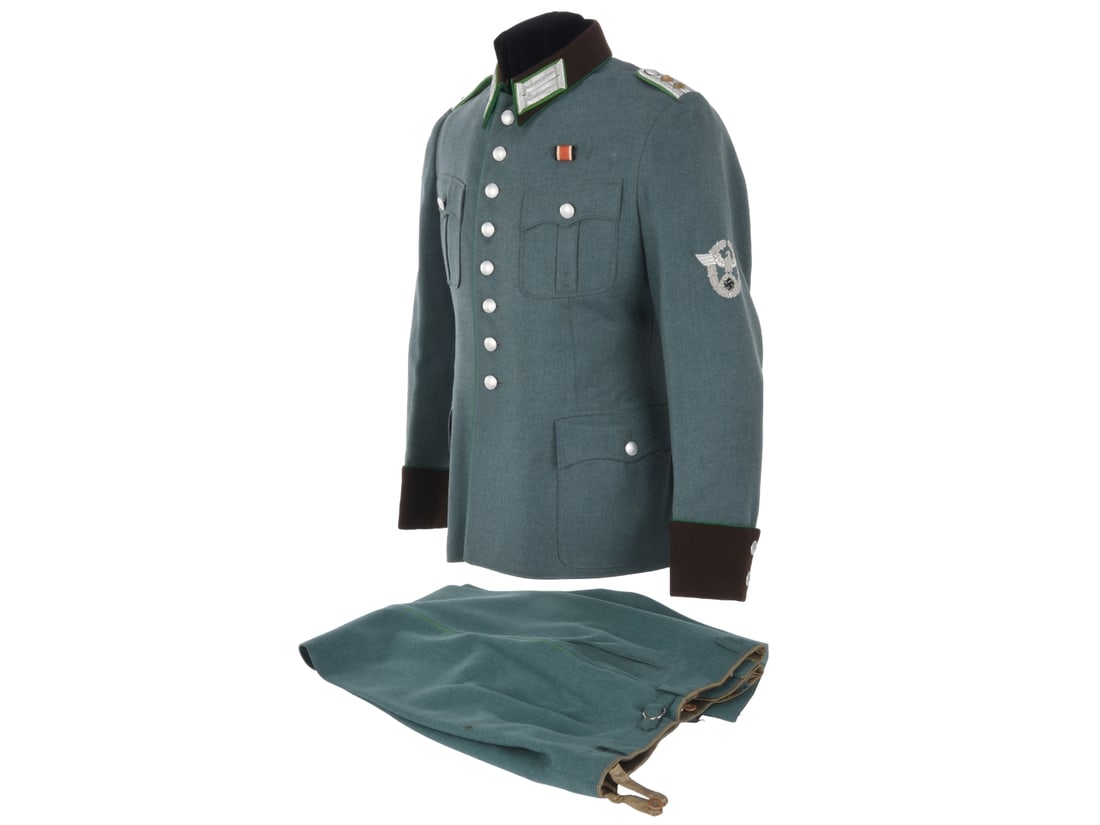 Schutzpolizei Hauptmann's Uniform Coat and Trousers: US 1st Division Officer's Souvenir: Schutzpolizei Hauptmann's Uniform Coat and Trousers: US 1st Division Officer's Souvenir. Police tunic of green gray wool has light green piping, dark brown cuffs and collar with Schupo officer collar 