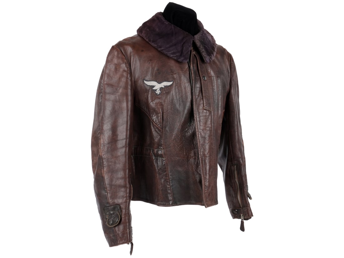Luftwaffe WWII Heated Leather Flight Jacket: Luftwaffe WWII Heated Leather Flight Jacket. Brown leather electrically heated flight jacket has lavender faux fur collar, Luftwaffe breast eagle that is sewn through the lining (original, but re-appl