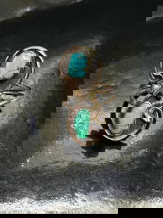 Vintage Navajo Sterling Silver Turquoise & Malachite Ring Signed: Offered is a striking vintage Navajo sterling silver ring featuring a flowing, handcrafted design with two bezel-set stones—one vivid turquoise and one green malachite. The organic, swirling silverw