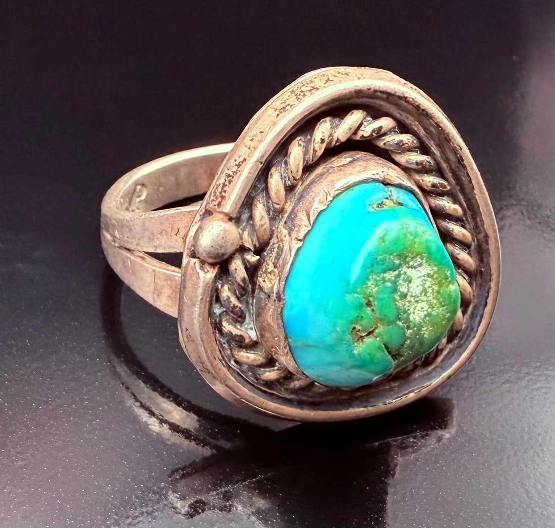 Sterling Silver Prince Trading Co. Kirtland Navajo Turquoise Ring size 7: This is a Sterling Silver Turquoise Navajo Native American ring. The ring is a size 7 when sized. The ring is stamped with the makers markings of “P”. The P stands for Prince Trading Co. Kirtl