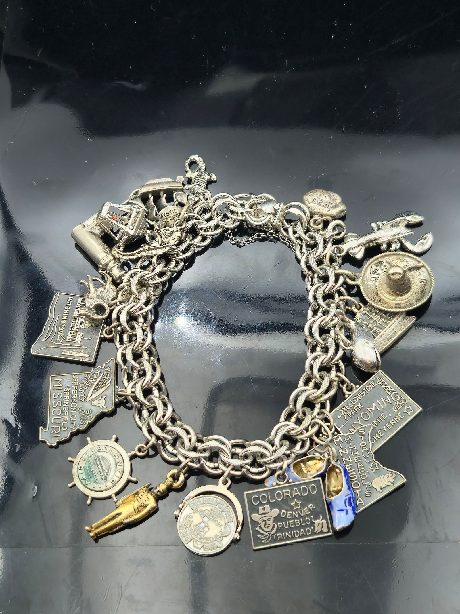 Vintage Elco Sterling Silver Travel Charm Bracelet – 19 Charms – 74.3g: This vintage sterling silver charm bracelet by Elco features 19 well-crafted travel- and souvenir-themed charms and weighs a substantial 74.3 grams. The bracelet is secured with a marked Elco Sterling
