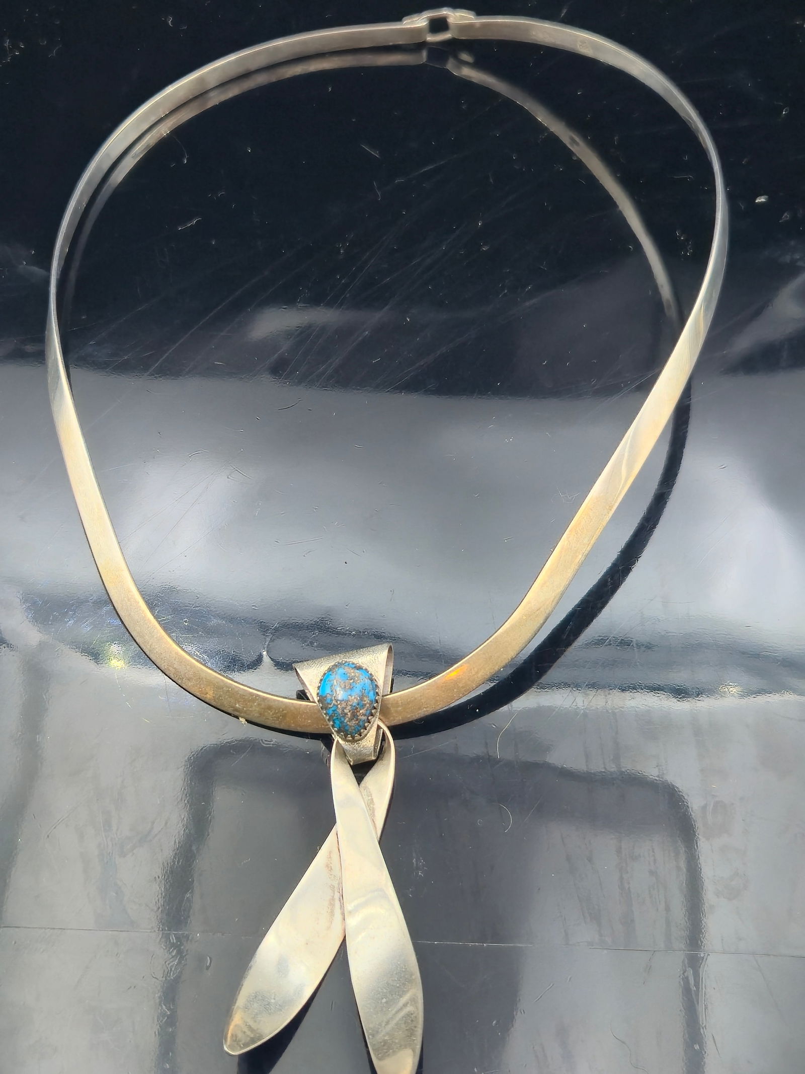 Native American Sterling Silver Collar Necklace – Turquoise & Petroglyph Pendant – Navajo/Hopi: This unique vintage Native American sterling silver collar necklace features a striking hand-forged pendant with a stylized petroglyph or “man in maze”/dancer figure, a motif often associated