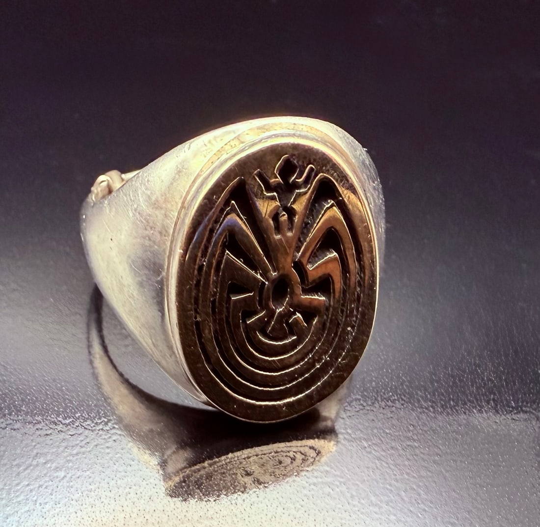 Sterling Silver and 14K gold Navajo Calvin Peterson Hopi Man in the Maze ring size 7: This is a signed Calvin Peterson ring that is made by the Navajo maker. It is makers Marked with his signature. Beautiful 14k gold Hopi man in the Maze design. The rest of the ring is Sterling Silver