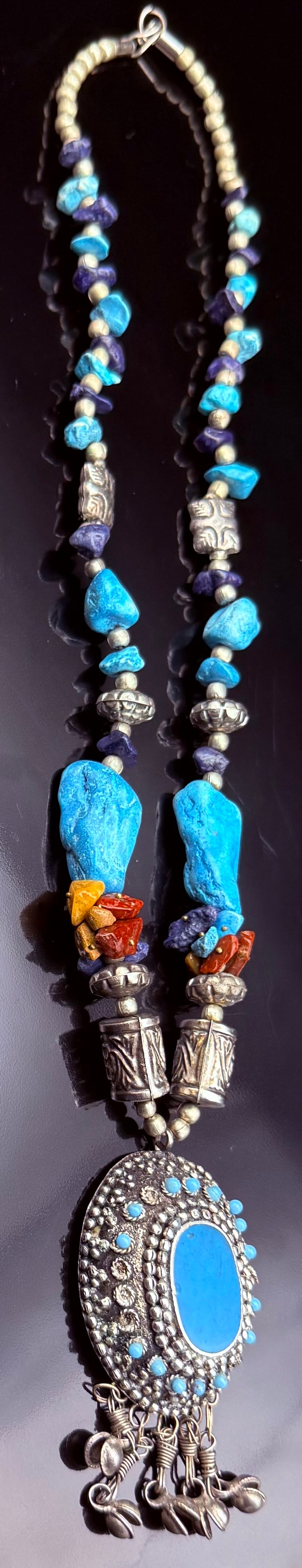 Silver Himalayan Tribal Designed Necklace With Amber,Turquoise, and Lapis stones: This is a hand crafted tribal-style necklace. This is from the Himalayan region such as Tibet, Nepal, or North India. Center Piece is Sterling Silver with Turquoise stones. There are Turquoise stones