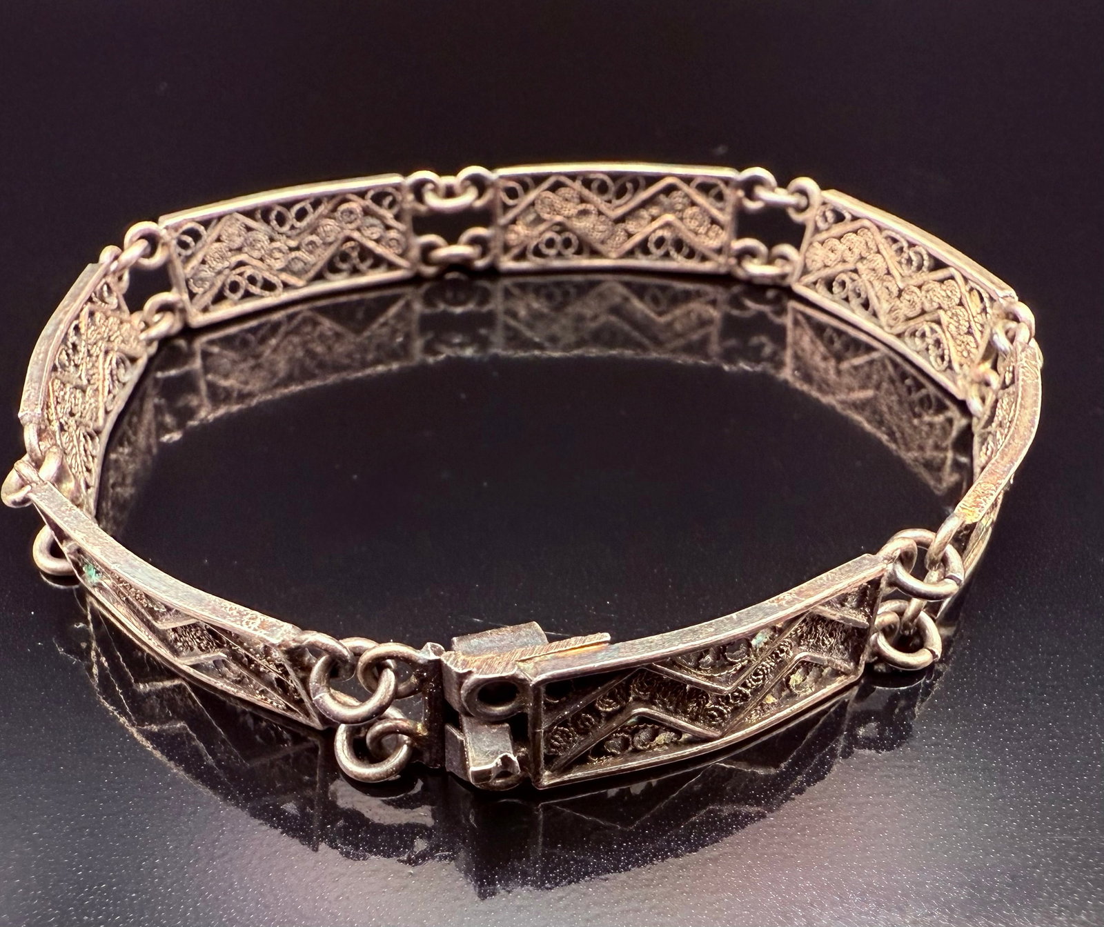 Silver 800 Filligree Art Deco 1970’s Slide Lock Bracelet: This is a Silver 800 Filligree Art Deco Slide locking Bracelet. This was a style from the 1970”s. The slide locking clasp is in working order. Beautifully designed with see through Z like engrav