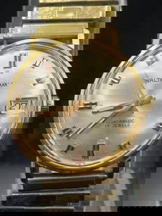 1960s Waltham Swiss 17J Automatic Wristwatch – Unworn with Box: Vintage Waltham wristwatch featuring a Swiss-made 17-jewel automatic movement signed “Waltham Watch Co.&rdquo;. The silver-tone dial displays gold-tone baton and Roman numeral hour markers, a date w