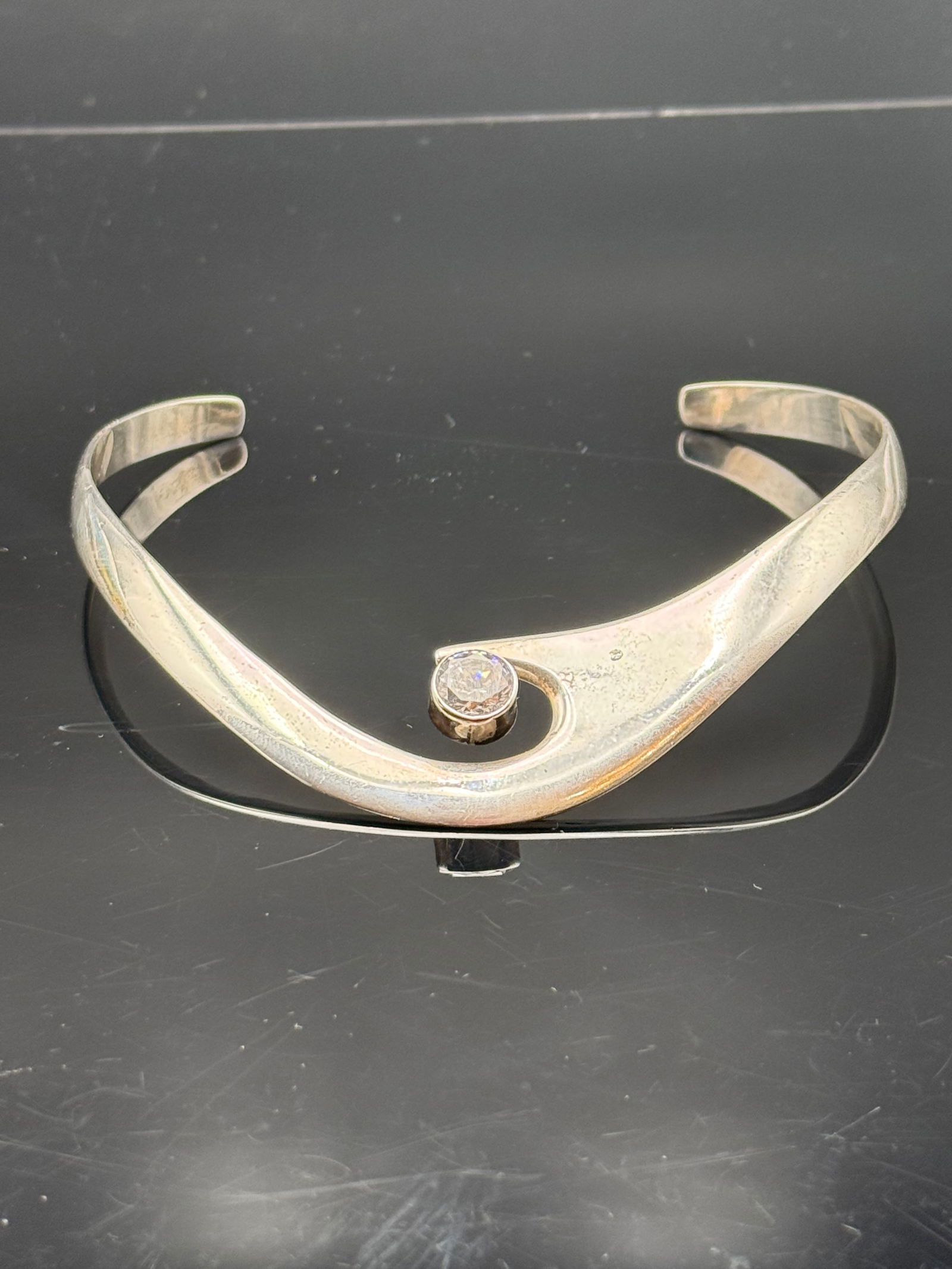 JVC TAXO MEXICO STERLING SILVER & CZ MODERNIST COLLAR NECKLACE: Modernist sterling silver and cubic zirconia (CZ) collar necklace, JVG, Taxco, Mexico, having minimalist curvilinear form, hallmarked TV-46, JVG, and 925 to reverse, approx 11"l, 57 grams (inclusive o