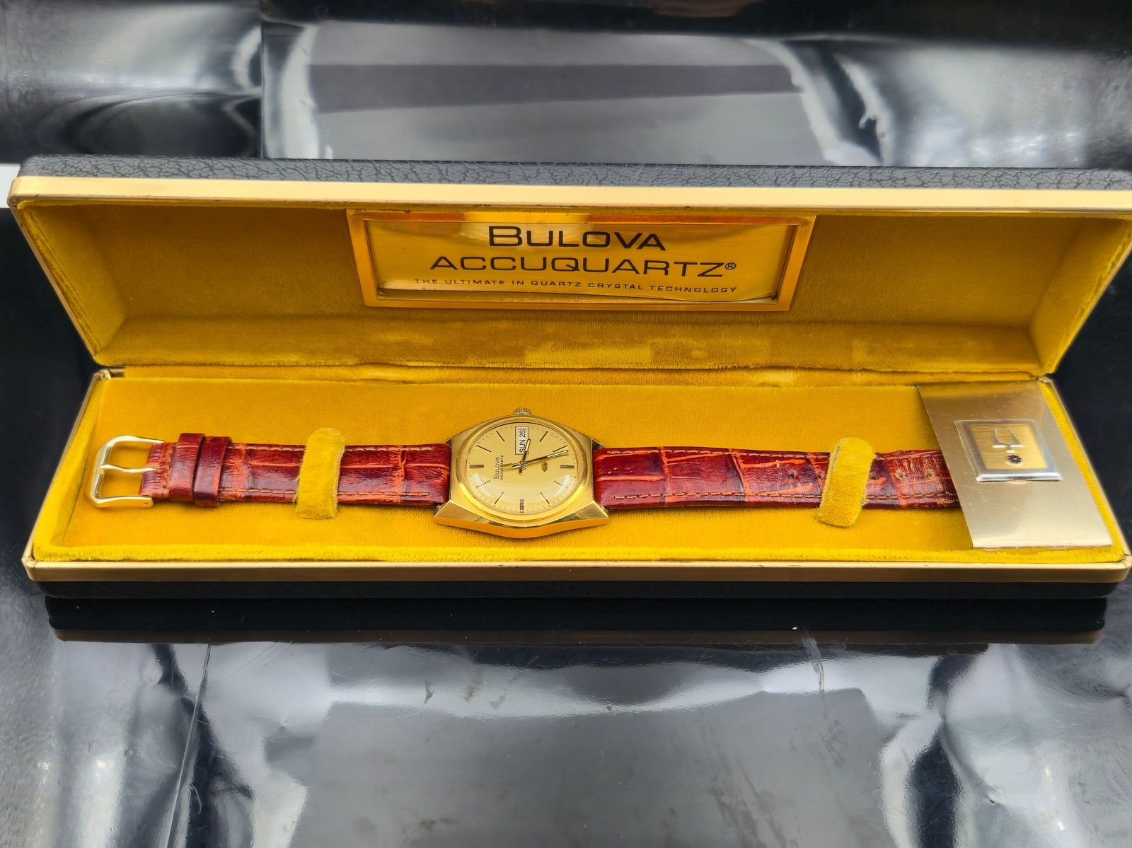 1974 Bulova Accuquartz Day-Date 2242 10K GF Boxed: 1974 Bulova Accuquartz men’s wristwatch featuring a Swiss 13-jewel quartz/tuning fork hybrid movement, caliber 2242, marked “Bulova U.S.A.” 10K gold-filled case with stainless steel back, re