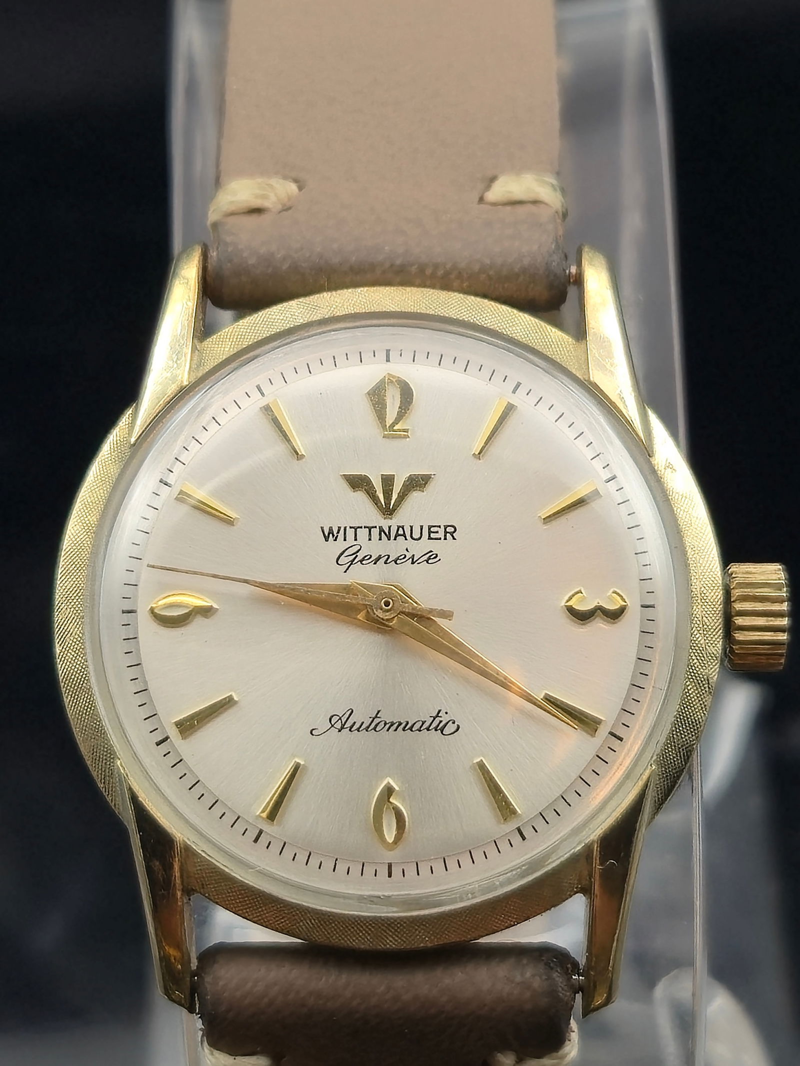 Wittnauer Genève Automatic 10K GF Bezel SS Back: Vintage Wittnauer Genève men’s wristwatch with a 10K gold-filled bezel and stainless steel back. Silver sunburst dial with applied gold-tone numerals at 12, 3, 6, and 9, and baton hour markers. Cen