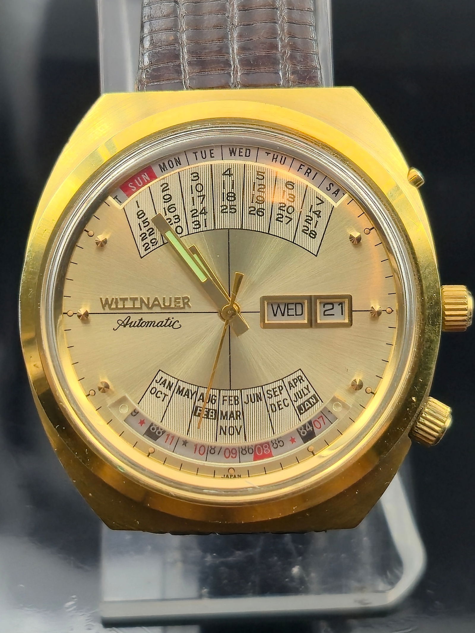 Wittnauer 2002 Automatic 17J Gold-Tone Triple Calendar Running: Vintage Wittnauer “2002” Automatic Triple Calendar, reference 2002-1, featuring a gold-tone case with stainless steel back. Champagne sunburst dial with applied markers, gold-tone hands, and b