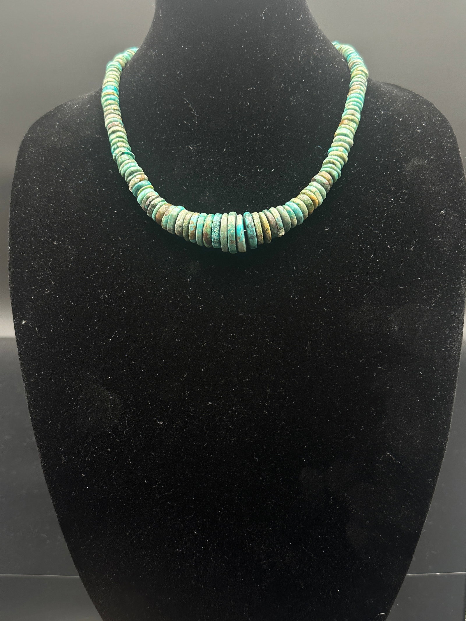 Vintage Natural Turquoise Heishi Disc Bead Necklace: Beautiful vintage necklace crafted with natural turquoise heishi disc beads in varying shades of blue-green with earthy brown matrix. The beads are hand-shaped, giving the piece an organic, rustic cha