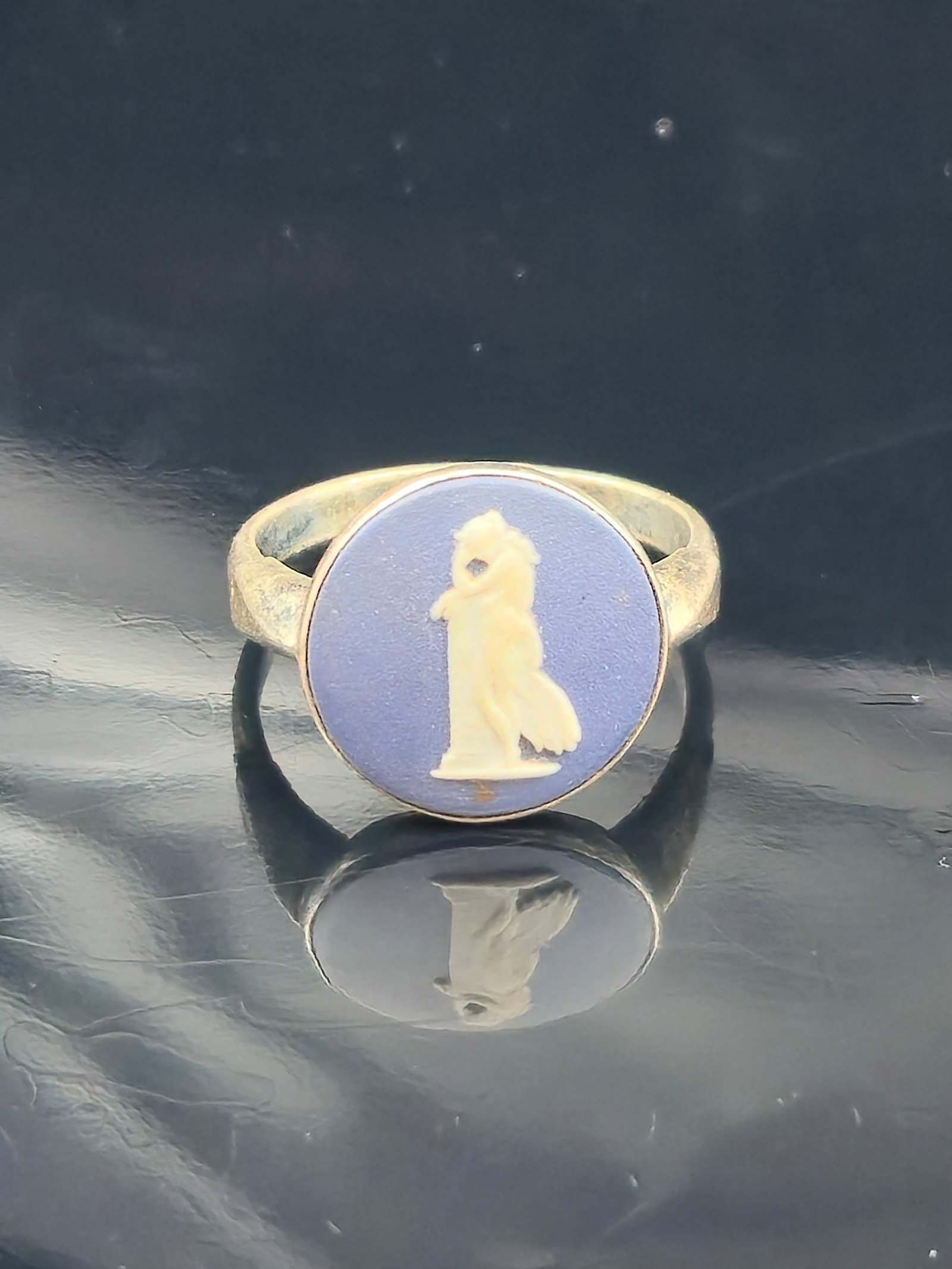 Wedgwood Sterling Silver Blue Jasper Cameo Ring, Size 6.5, 2.3g: Vintage Wedgwood sterling silver ring featuring a classic blue jasperware cameo with a white neoclassical figure. The jasperware is impressed on the back “WEDGWOOD MADE IN ENGLAND.” The silver