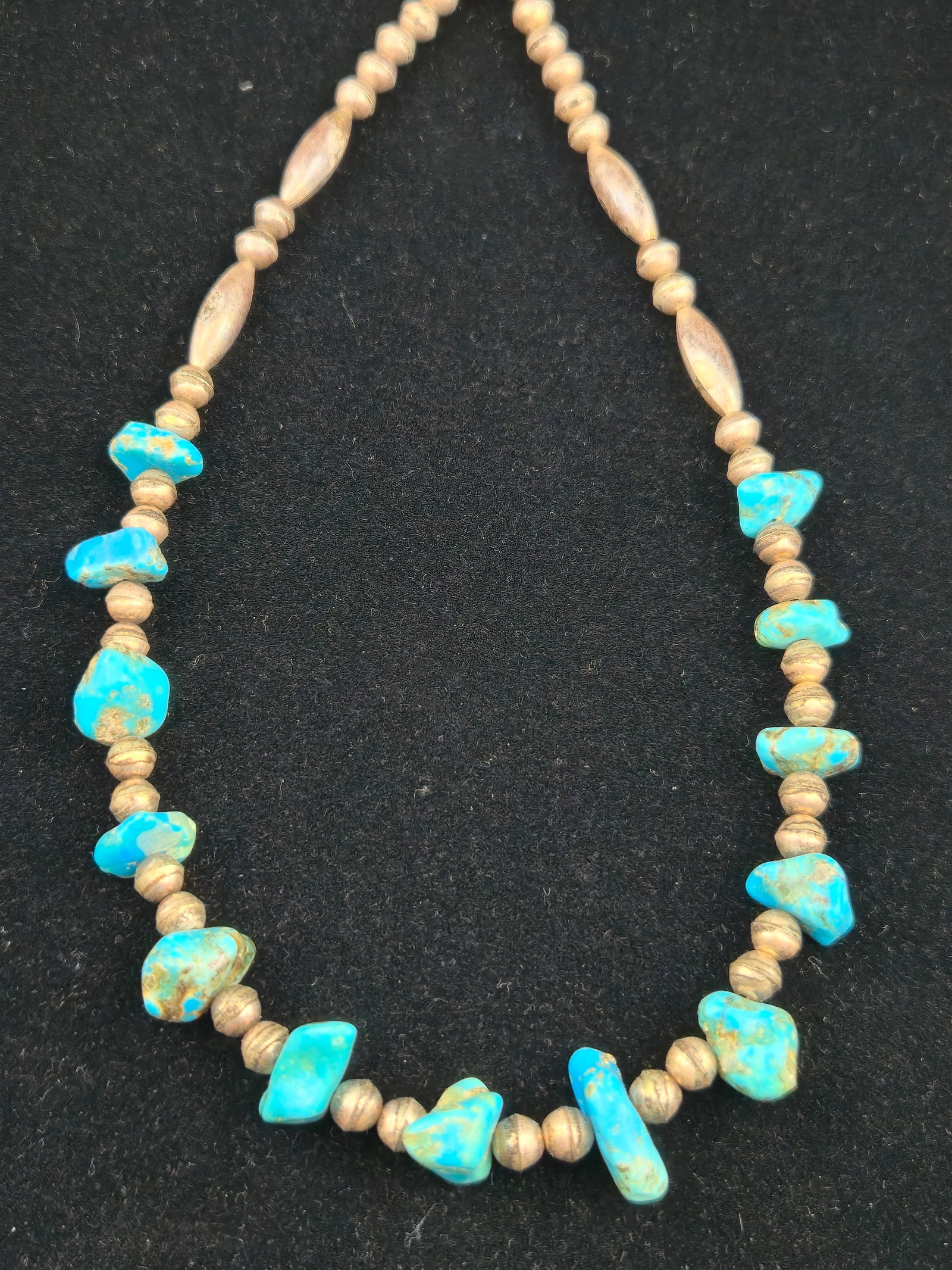 Vintage Navajo Sterling Silver Bench Bead Turquoise Nugget Necklace 25.7g: Vintage Southwestern Native American necklace featuring natural turquoise nugget beads accented with handmade sterling silver bench beads and elongated melon beads. Traditional hook clasp closure. Dis