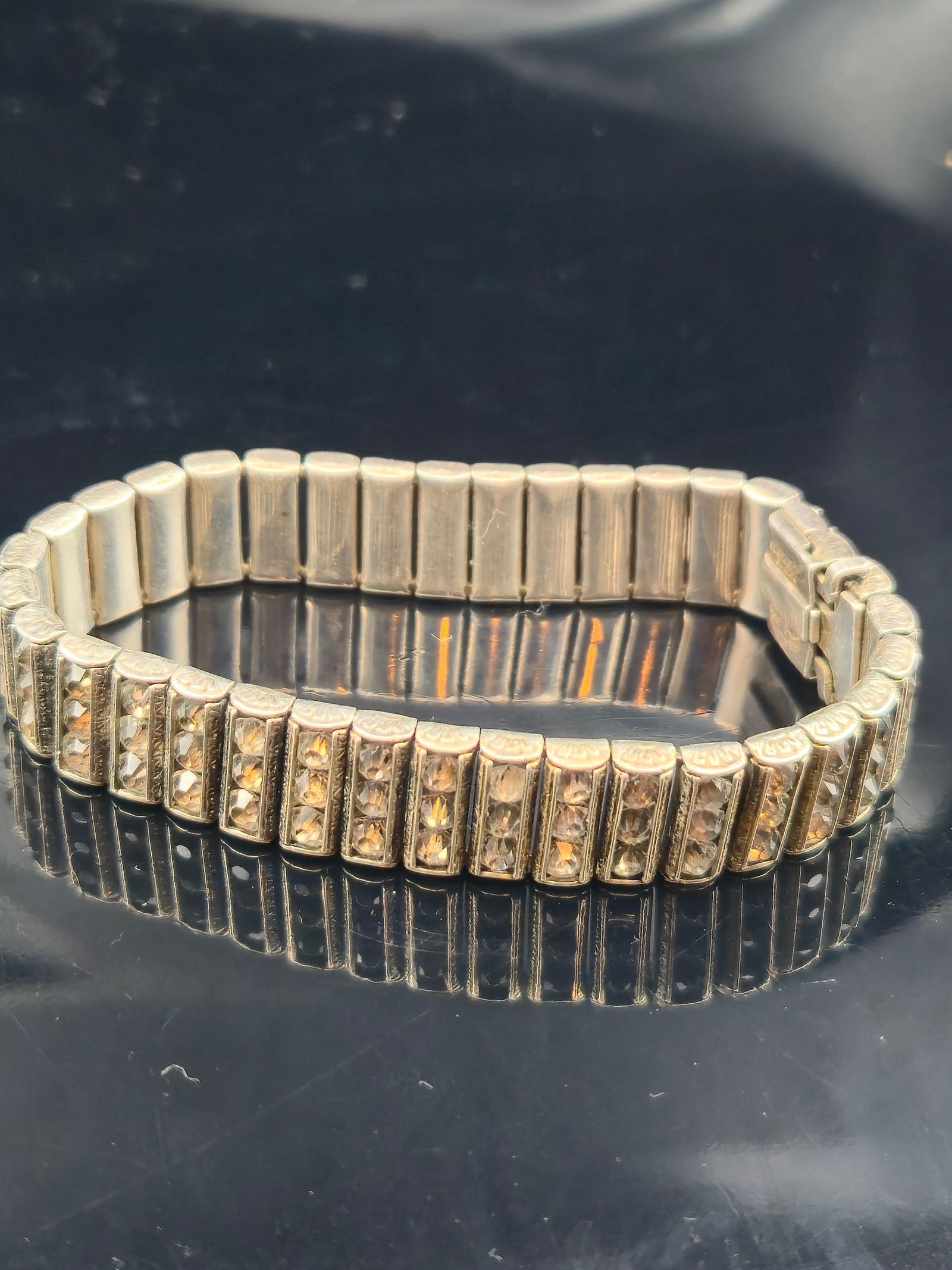 Art Deco Sterling Silver Expansion Bracelet, F&M Co., Patent July 7, 1925, 27g: An Art Deco sterling silver expansion bracelet, patented July 7, 1925, and stamped by maker F&M Co. (Finberg & Mayer, Attleboro, MA). The bracelet features faceted crystal/rhinestone panels in a stret
