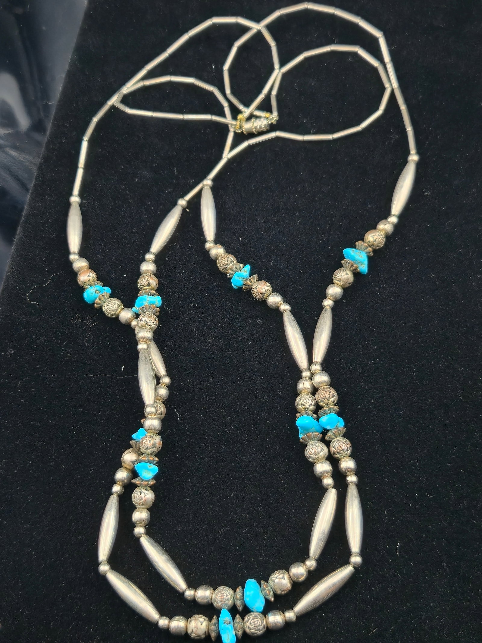 30.9g Native American Sterling Silver Bead Necklace w/ Turquoise: Vintage Native American sterling silver bead necklace, weighing 30.9 grams. The necklace features hand-wrought elongated sterling tube beads, round beads, and stamped sterling rose-pattern beads, acce