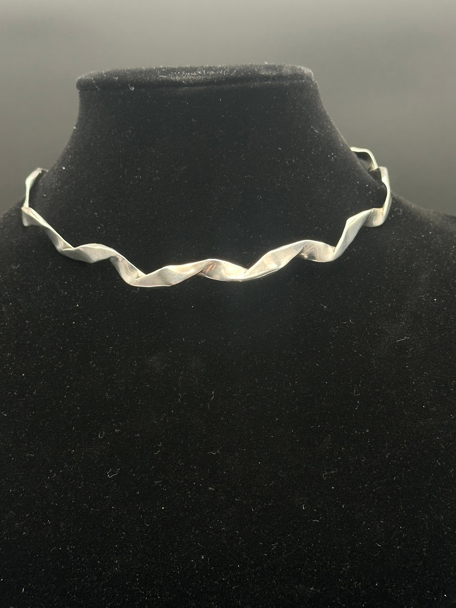Sterling Silver Twisted Ribbon Collar Necklace, 925: Striking sterling silver collar necklace featuring a bold twisted ribbon design. The polished surface reflects light beautifully, giving the piece a sculptural, modernist aesthetic. Stamped 925 on the