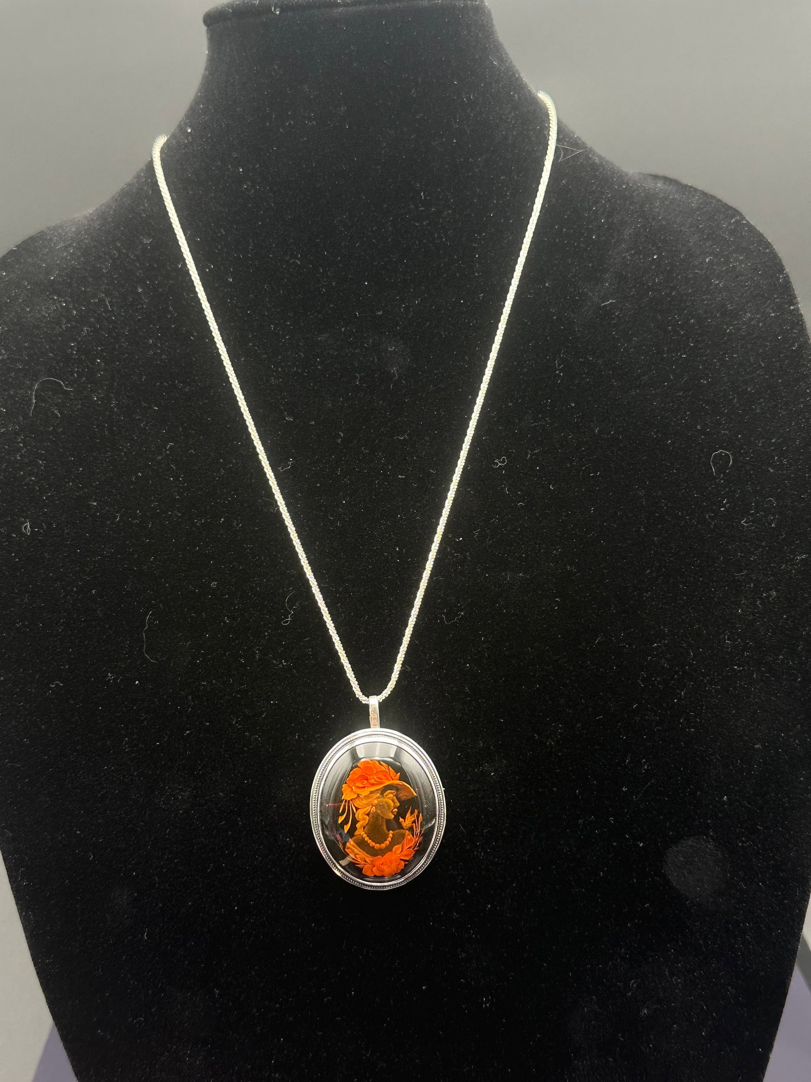 Vintage Sterling Silver Italian Cameo Pendant & Brooch, Hand-Carved Design: Elegant vintage cameo pendant brooch crafted in sterling silver with a beautifully detailed hand-carved relief of a woman adorned with flowers and a wide-brimmed hat. The carving features warm hues of