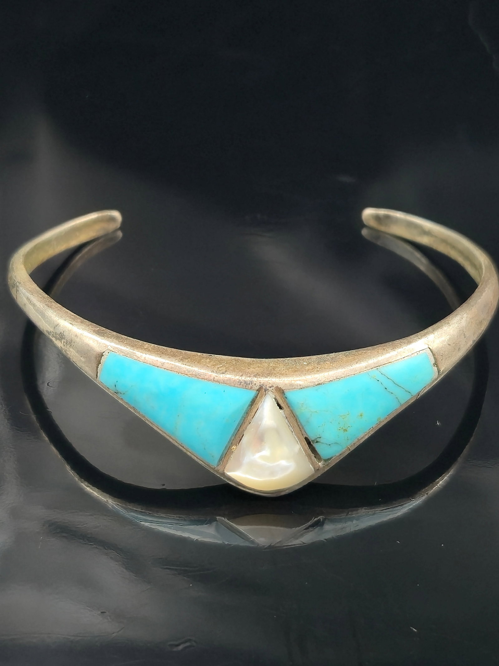 Zuni Sterling Silver Turquoise & Mother of Pearl Inlay Cuff Bracelet 55mm Wide Vintage 13.4g: Authentic Zuni sterling silver cuff bracelet featuring traditional channel inlay of turquoise and mother of pearl. The clean geometric design creates a bold centerpiece at the front of the cuff. Inter