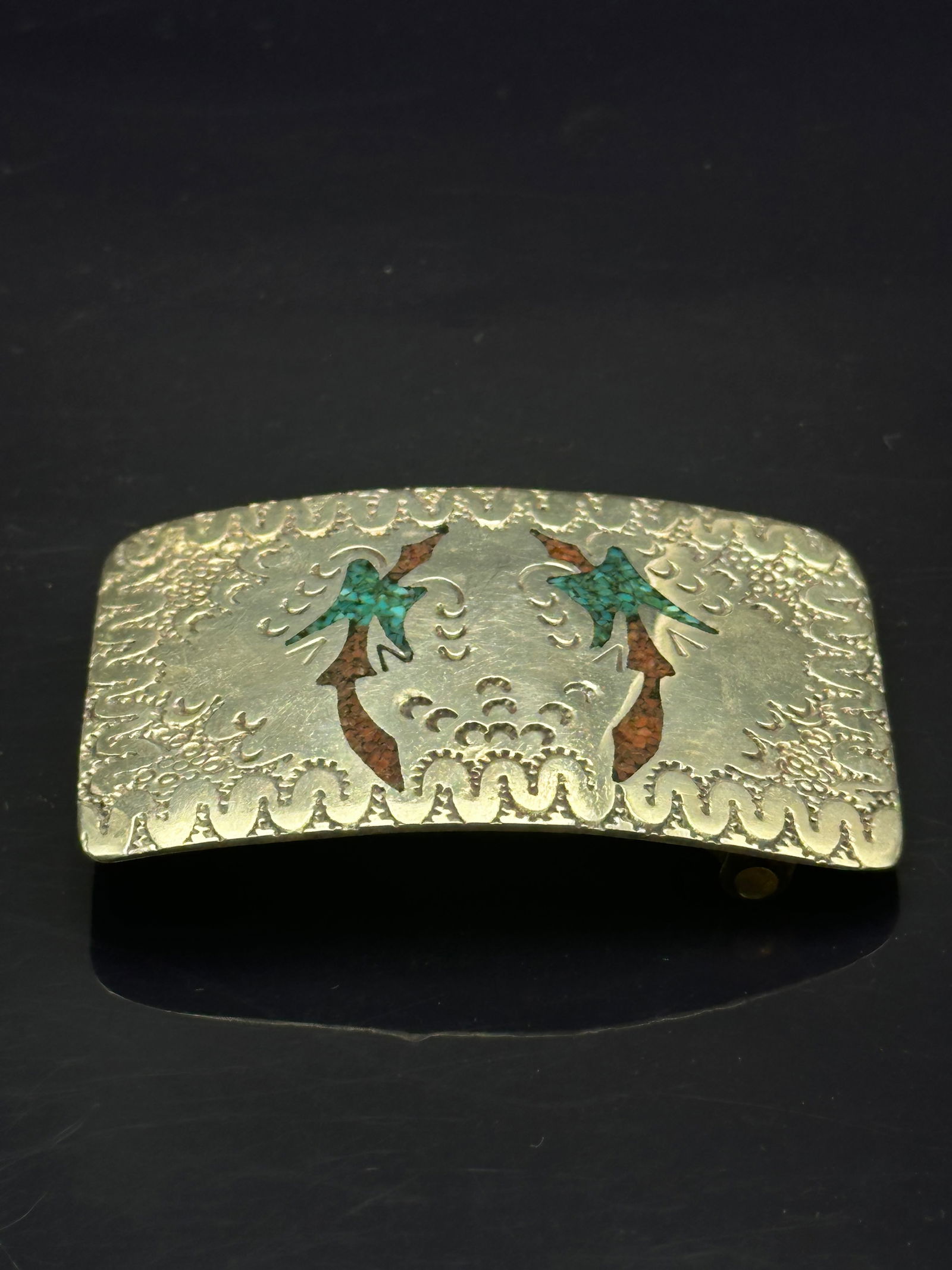 Vintage Navajo Sterling Silver Belt Buckle with Turquoise & Coral Inlay, 45g: A vintage Navajo-style sterling silver belt buckle decorated with turquoise and coral chip inlay forming stylized bird motifs, possibly thunderbirds. Surrounded by intricate stamped and textured patte