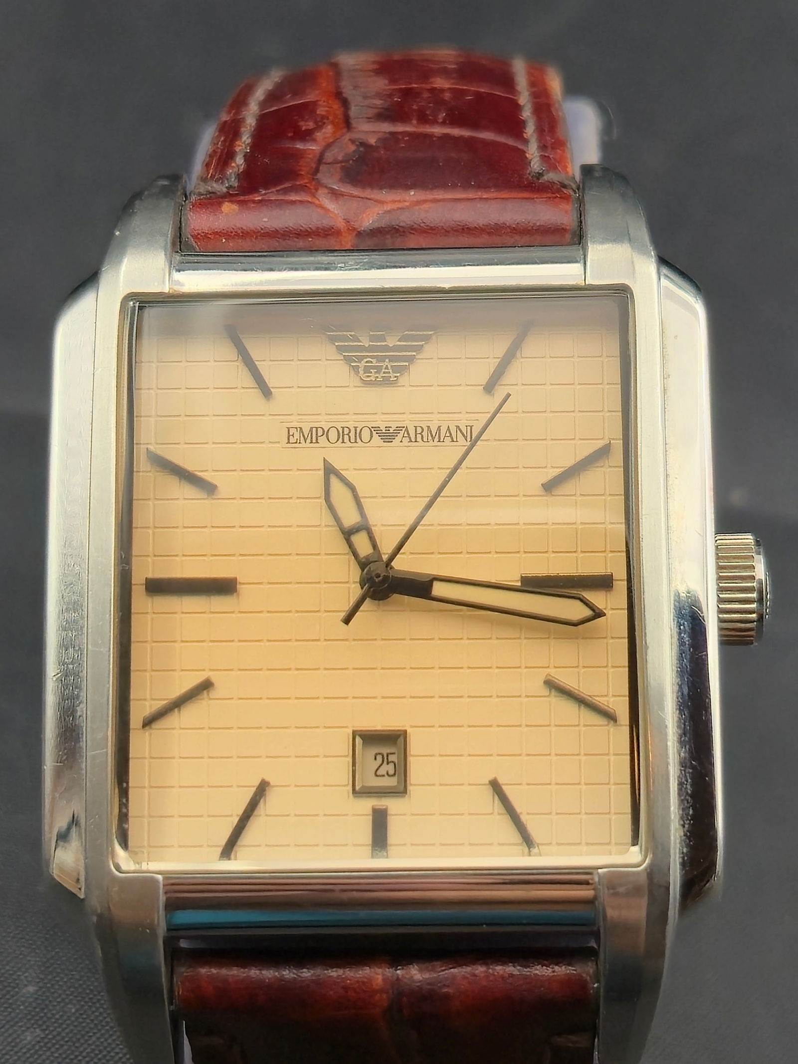 Emporio Armani AR-0477 38mm Stainless Steel Quartz Wristwatch with Date: Emporio Armani AR-0477 men’s dress wristwatch featuring a square stainless steel case (approx. 38mm), cream textured dial with applied hour markers, Armani eagle logo at 12 o’clock, and quick-set