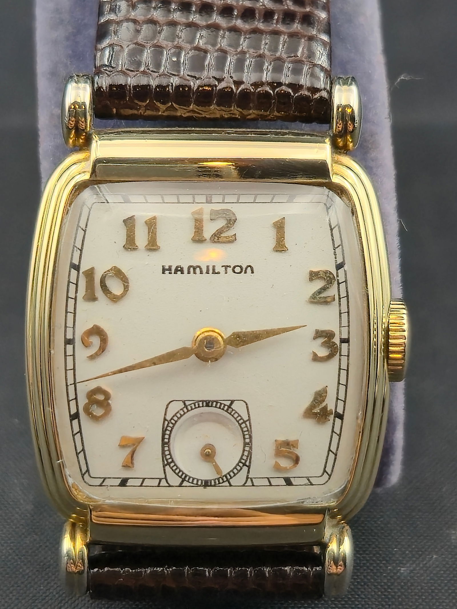 1947 Hamilton 14K GF 24mm Tank-Style Wristwatch, Cal. 982 19J: Offered here is a circa 1947 Hamilton men’s wristwatch, housed in a Wadsworth 14K gold-filled case (serial 4382532). The case measures 24.4mm wide and features distinctive tank-style lines with tubu