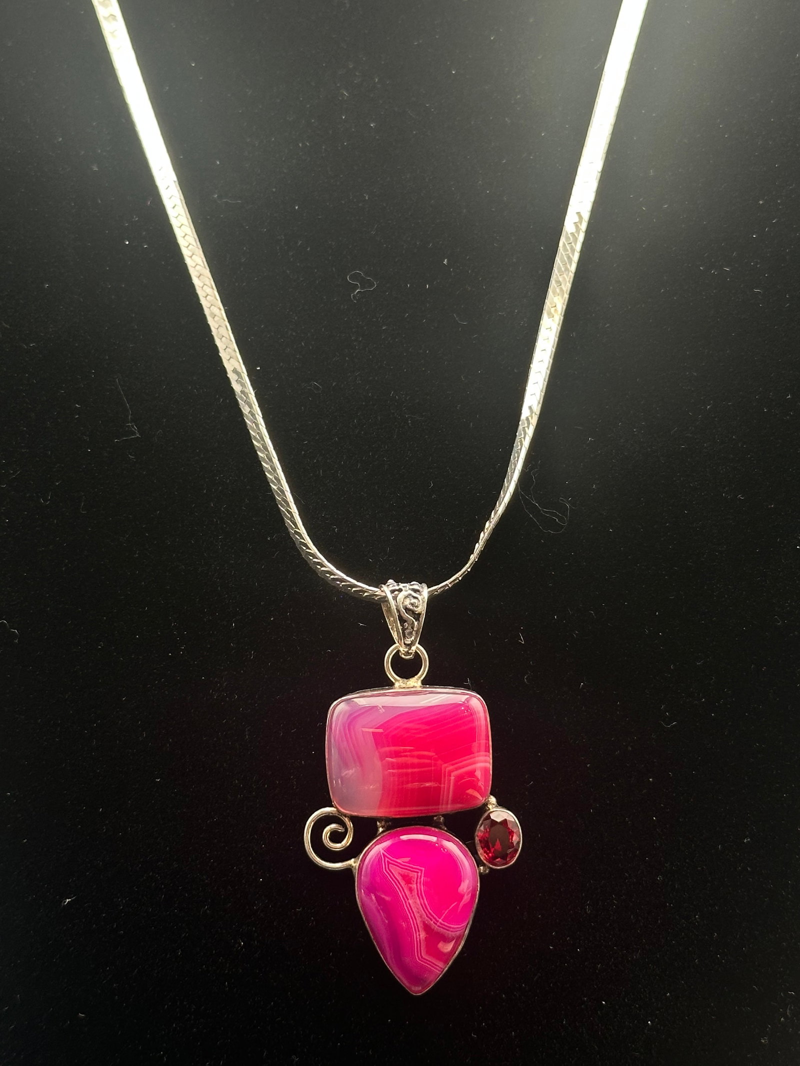 Sterling Silver Modernist Pink Cabochon Pendant Necklace, 35g: A bold sterling silver necklace featuring a modernist pendant set with two large polished pink cabochon stones and a small round red accent stone. The geometric design is enhanced by sterling silver s