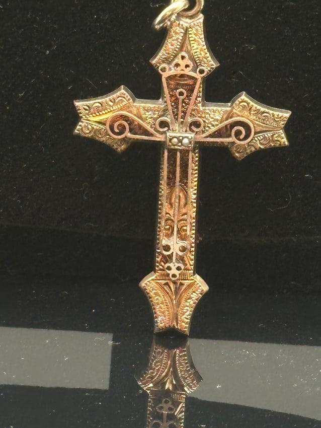Vintage Ornate Gold-Tone Cross Pendant: Beautiful vintage cross pendant featuring intricate raised and engraved detailing on the front and a smooth, polished back. Crafted in a gold-tone finish with decorative scrollwork and textured patter