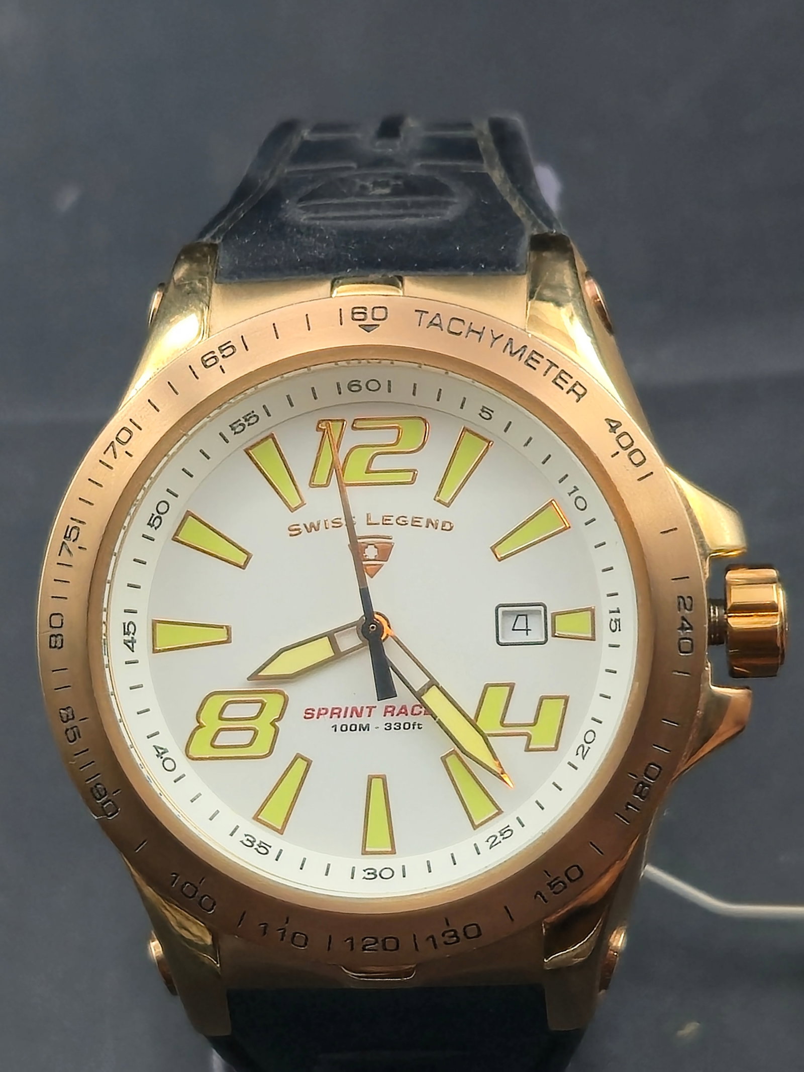 Swiss Legend Sprint Racer Men’s Watch 48mm Rose Gold Tone Tachymeter: bold Swiss Legend Sprint Racer men’s wristwatch featuring a 48mm rose gold-tone stainless steel case, white dial with oversized luminous yellow numerals (12, 4, 8), baton markers, and date window at