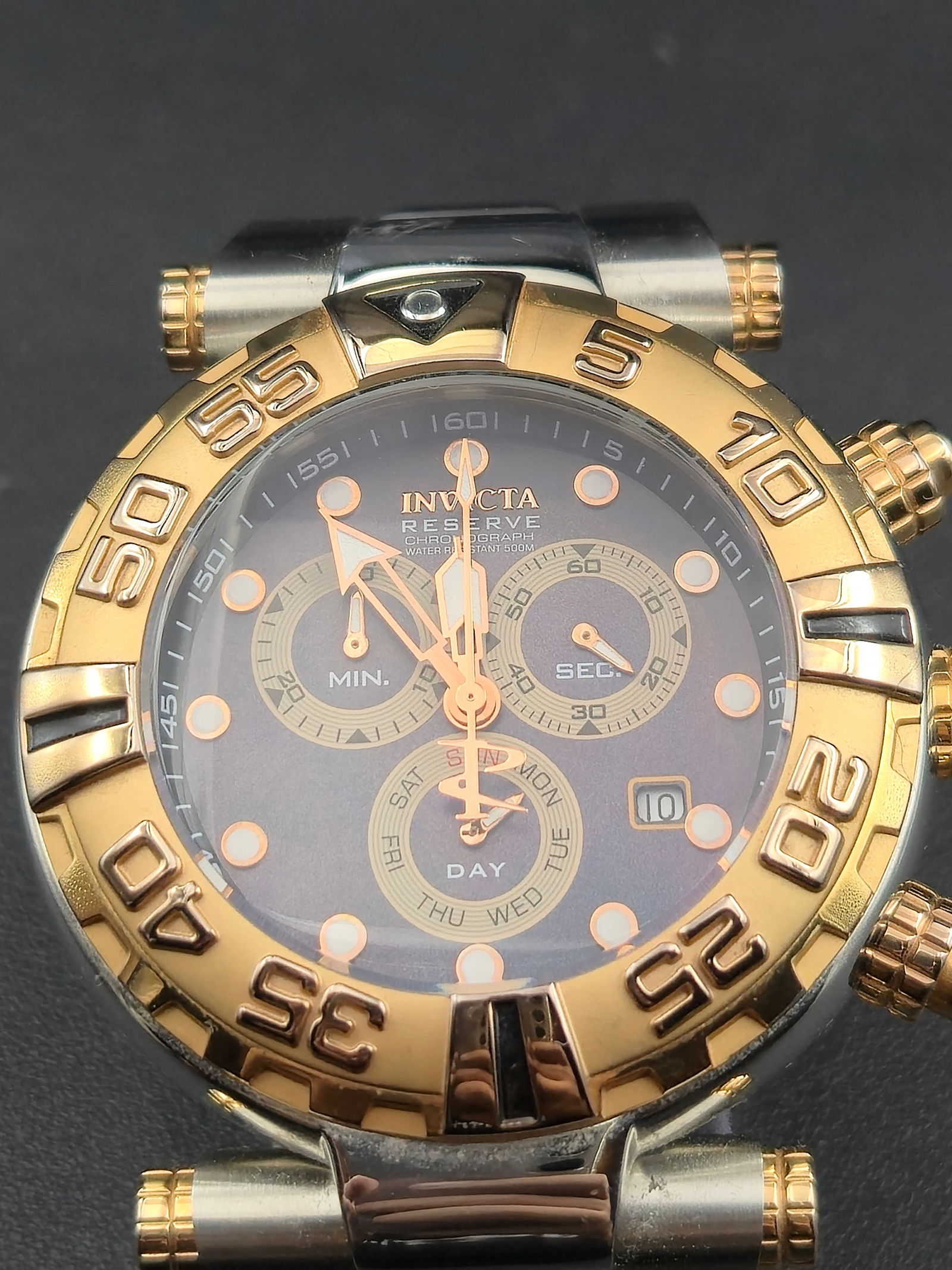 2000s Invicta Reserve Subaqua Noma I Chronograph 50mm 500M Two-Tone: Offered here is a bold Invicta Reserve Subaqua Noma I chronograph wristwatch. This model features a large 50mm stainless steel and gold-tone case with screw accents, matching two-tone bracelet, and a