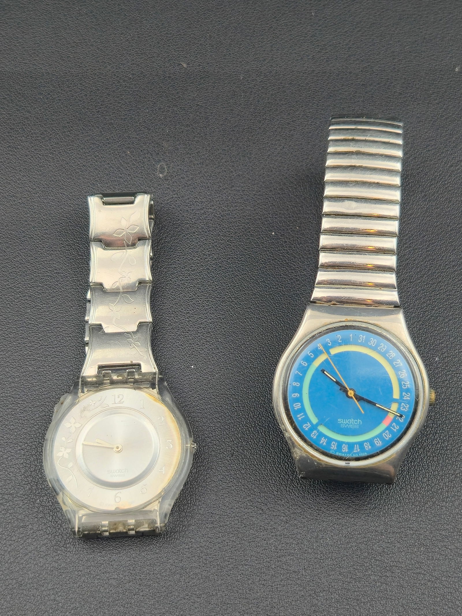 Pair of 1990s–2000s Swatch Swiss Watches: Offered here is a pair of original Swatch Swiss wristwatches from the 1990s–2000s era. Both are currently not running and offered as-is for repair or parts.The first is a Swatch Irony Lady (circa 20