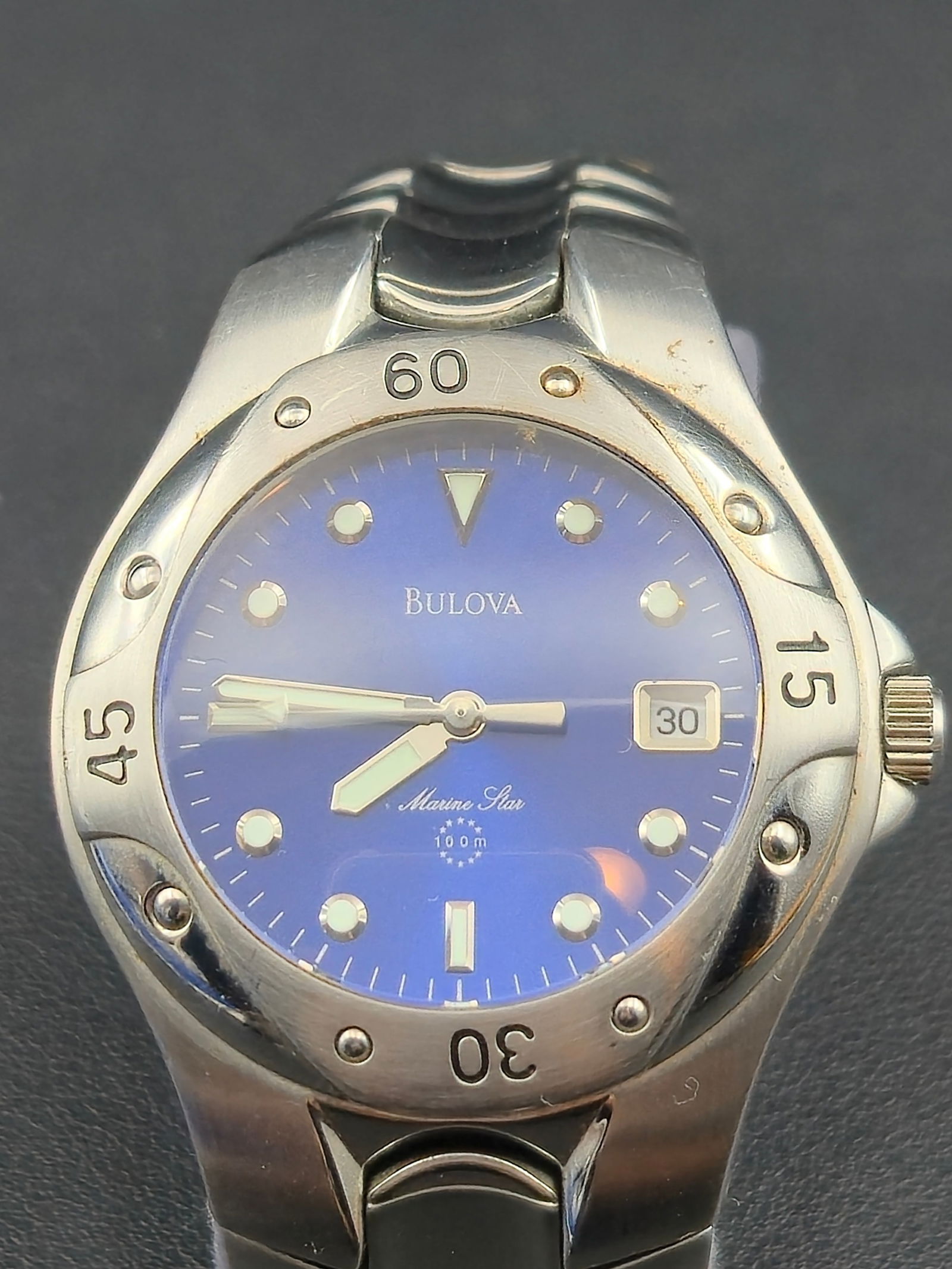 1990s Bulova Marine Star 37mm Stainless Steel Blue Dial Quartz Diver Watch Running: Bulova Marine Star men’s wristwatch, circa 1990s. Features a 37mm stainless steel case with unidirectional diver bezel, striking blue dial with luminous markers and hands, and a date window at 3 o��