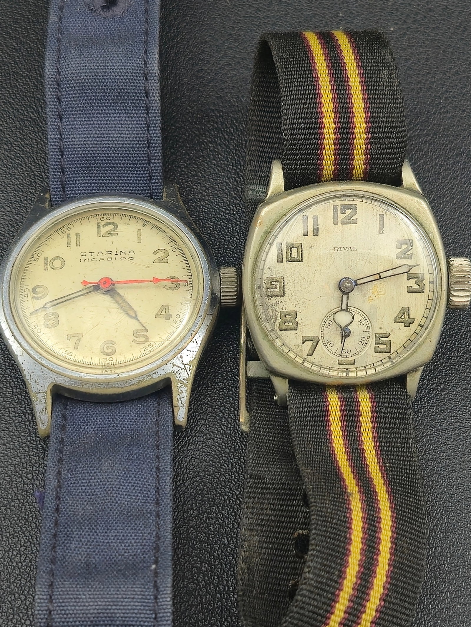 Lot of 2 Vintage Swiss Wristwatches – Starina 15J Incabloc & Rival 6J Sub-Seconds – Untested: pair of vintage Swiss-made wristwatches from the mid-20th century, both featuring mechanical hand-wind movements and classic military-style aesthetics.1. Starina Watch Co. (15 Jewels Incabloc) – Man