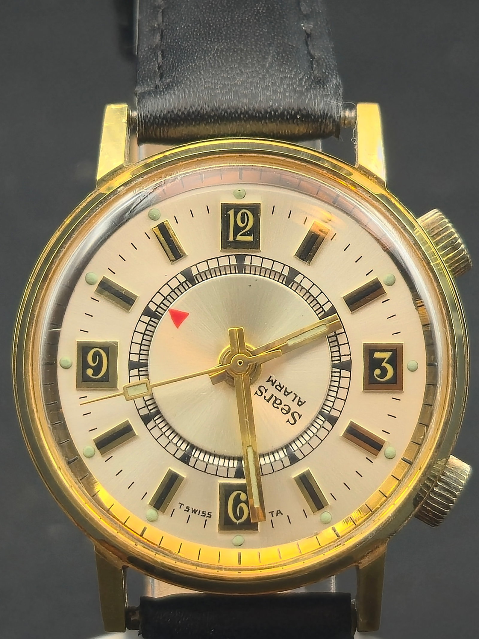 Sears Swiss Dual-Crown Alarm Watch by Agon Chromatic 1J Gold-Tone 36mm (Running): Vintage Sears mechanical alarm wristwatch, manufactured in Switzerland by Agon Chromatic Watch Corp. and powered by a Caliber 1475 one-(1)-jewel manual-wind movement.This dual-crown design features on