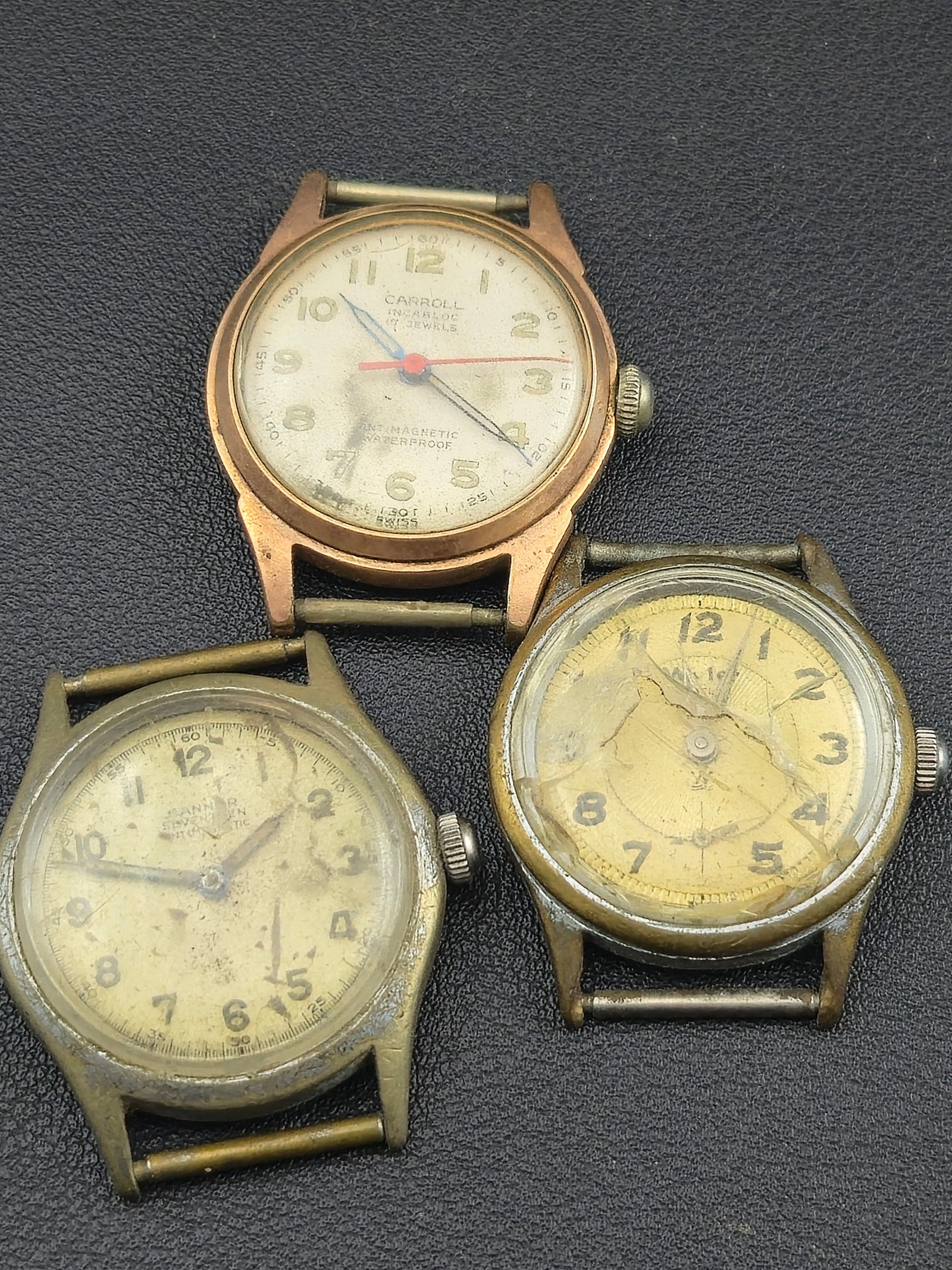 Vintage Swiss Wristwatch Trio – Carroll, Banner & Wyler Incaflex 17J Manual Wind Lot: group of three mid-century Swiss wristwatches, all untested for function. Includes a Carroll Incabloc 17-jewel gold-tone wristwatch with red sweep second hand and Fulton Watch Co. Swiss movement, a Ba