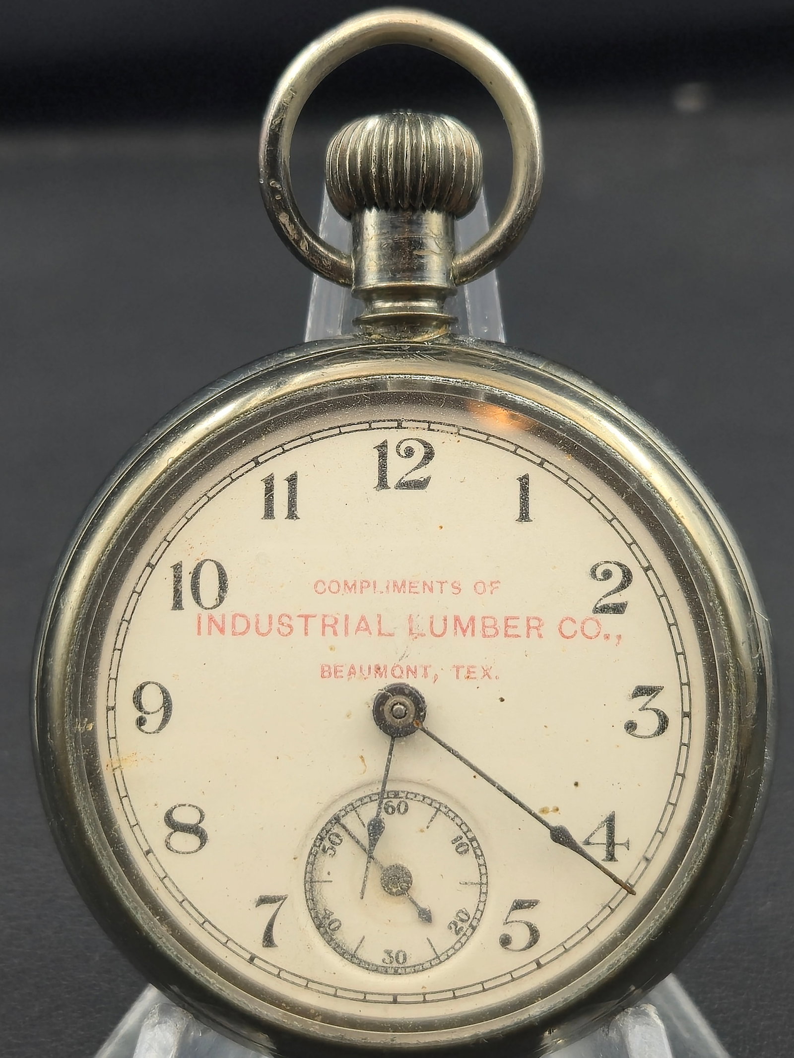 Early 1900s Promotional Pocket Watch – Industrial Lumber Co. Beaumont, Tex. – Untested: Vintage Industrial Lumber Co. advertising pocket watch, issued as a promotional timepiece for the Industrial Lumber Company of Beaumont, Texas, likely produced in the early 1900s.The white enamel dial
