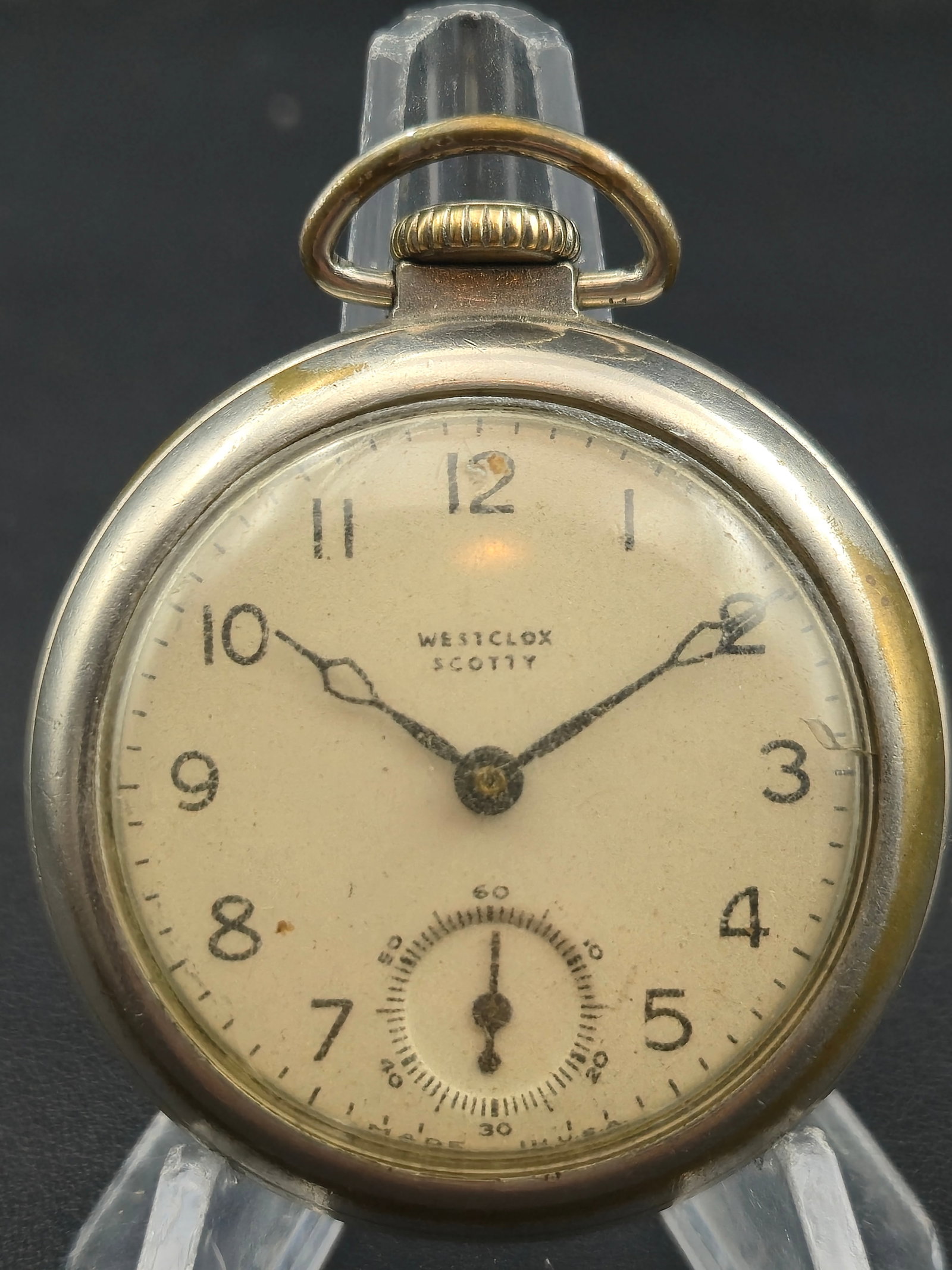 1940s Westclox “Scotty” Nickel 50mm Pocket Watch – Sub Seconds – Runs: Vintage Westclox “Scotty” pocket watch, circa 1940s–1950s, featuring a cream-tone dial with bold Arabic numerals and ornate blued hands. The sub-seconds dial at 6 o’clock and simple round 