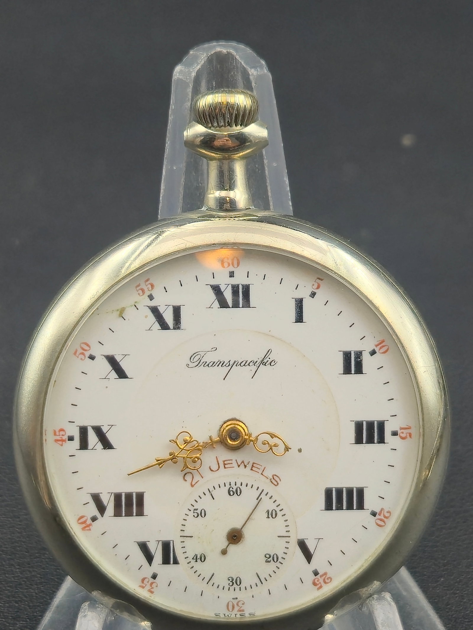 Swiss Trans Pacific 21J Pocket Watch – Langendorf Movement – Roman Dial – Running: Vintage Trans Pacific Swiss pocket watch, powered by a 21-jewel movement manufactured by the Langendorf Watch Co. (LWC) of Switzerland. The movement is beautifully finished with gilt gears, polished s